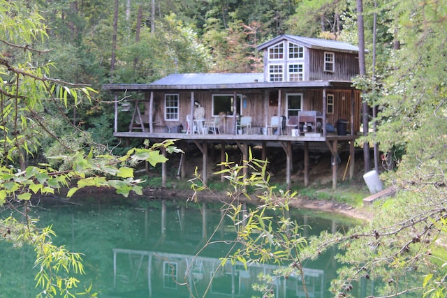 exterior space with a water view