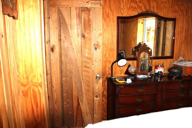 bedroom with wooden walls