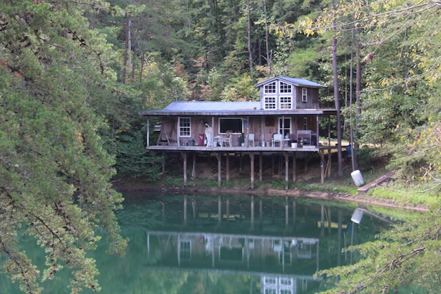 back of house featuring a water view