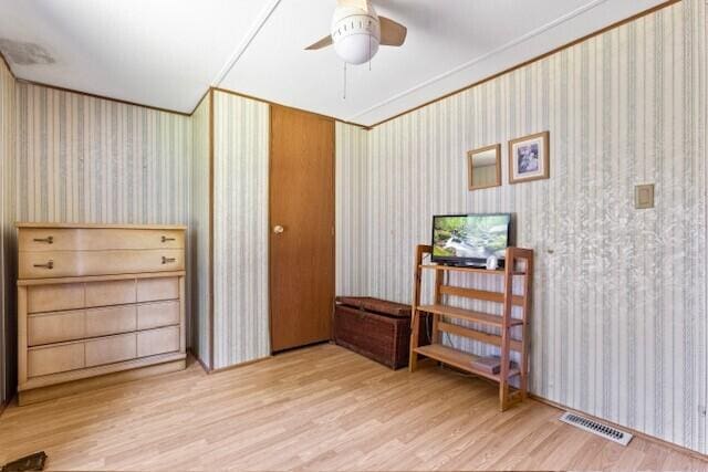 bedroom with ceiling fan and light hardwood / wood-style flooring