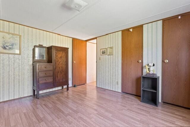 spare room with hardwood / wood-style floors