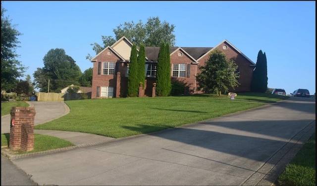 view of front of home with a front lawn