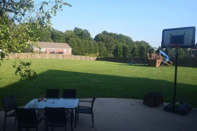 view of yard with a patio area and a playground