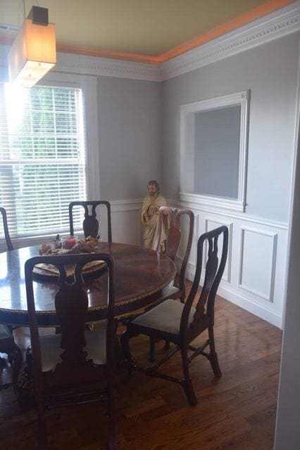 dining space featuring wood-type flooring