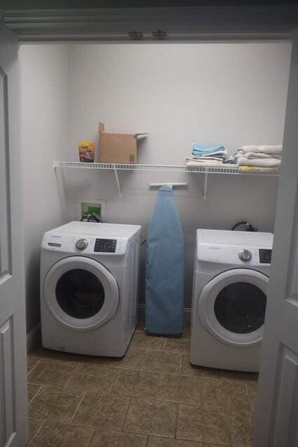 laundry area featuring washer / clothes dryer