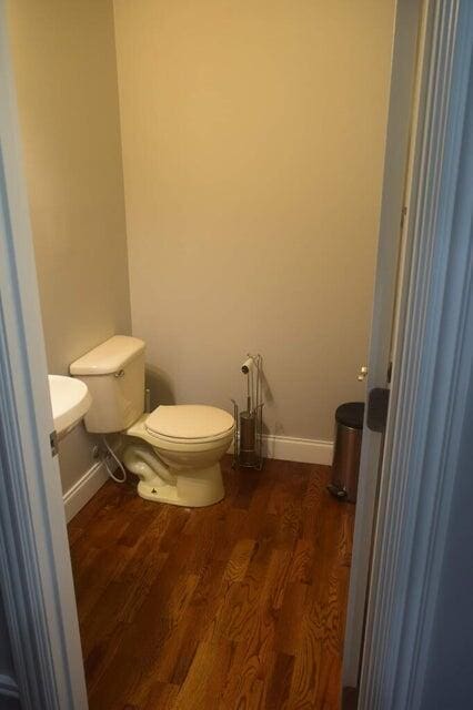 bathroom featuring toilet and hardwood / wood-style floors