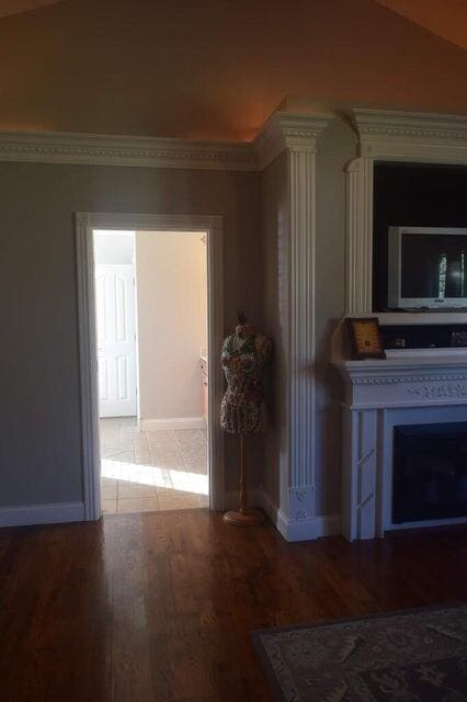 interior space with vaulted ceiling and hardwood / wood-style flooring