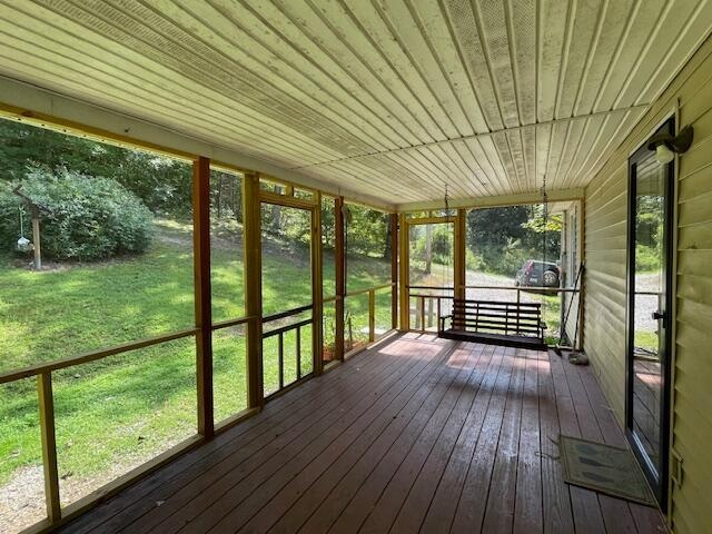 unfurnished sunroom with a healthy amount of sunlight