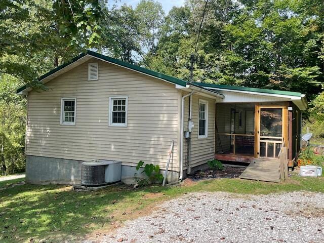 back of house featuring central AC