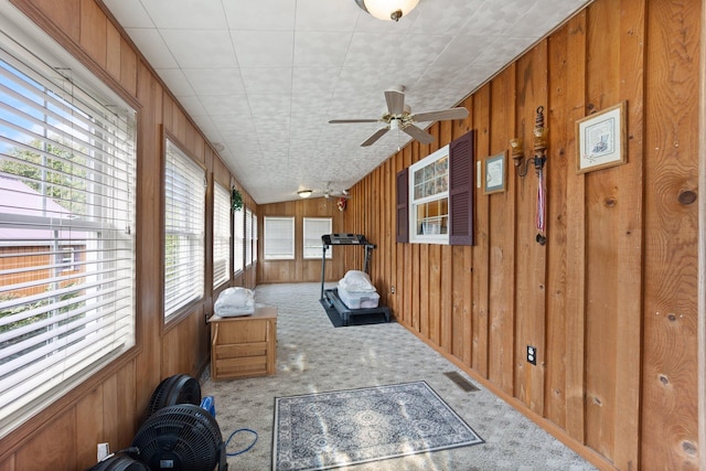 sunroom / solarium with ceiling fan