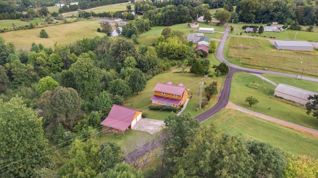 birds eye view of property with a rural view