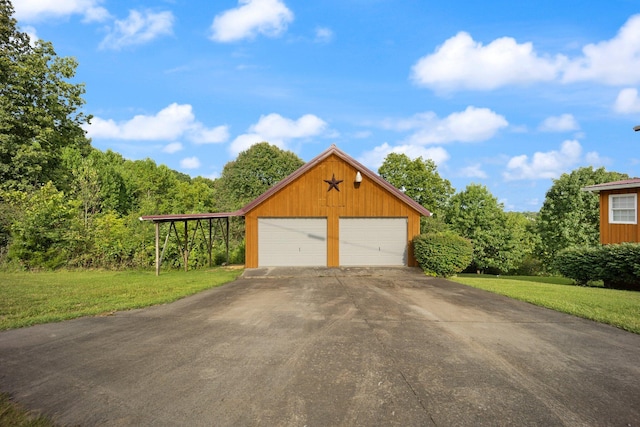 garage with a yard