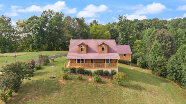 view of front of house with a front yard and a porch