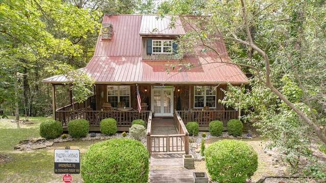 view of front of home featuring french doors and a porch