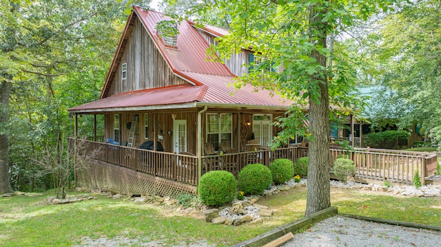 view of front of property with a front yard and a porch