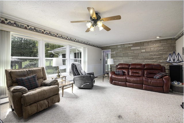 carpeted living room with a textured ceiling and a ceiling fan