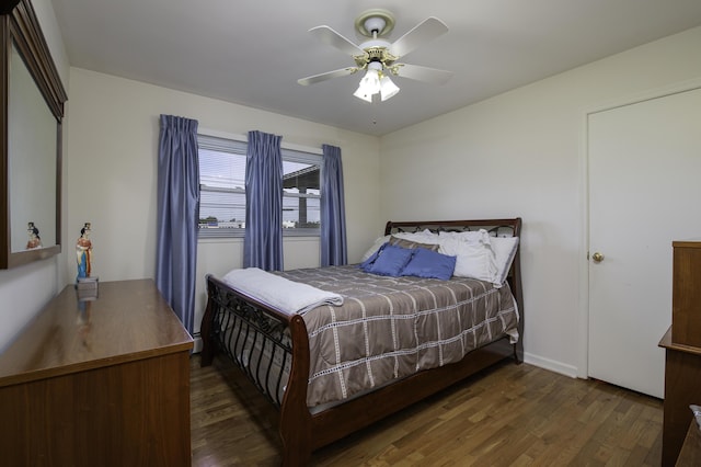 bedroom featuring a ceiling fan and wood finished floors