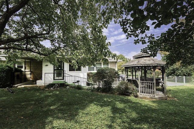 view of yard featuring a gazebo and fence