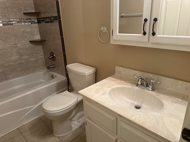 full bathroom featuring tile patterned flooring, vanity, toilet, and tiled shower / bath