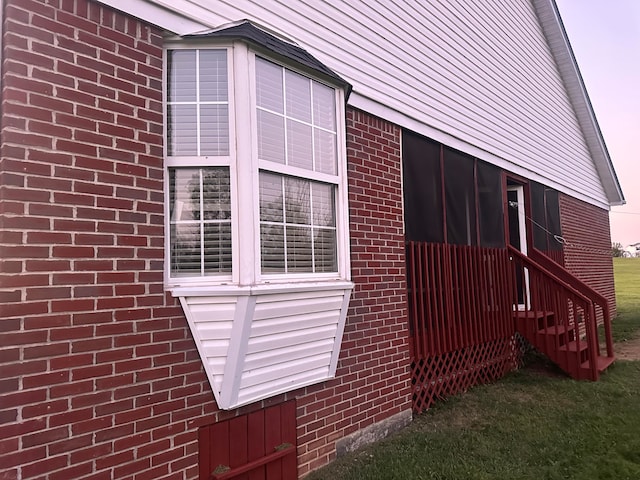 view of home's exterior with a lawn