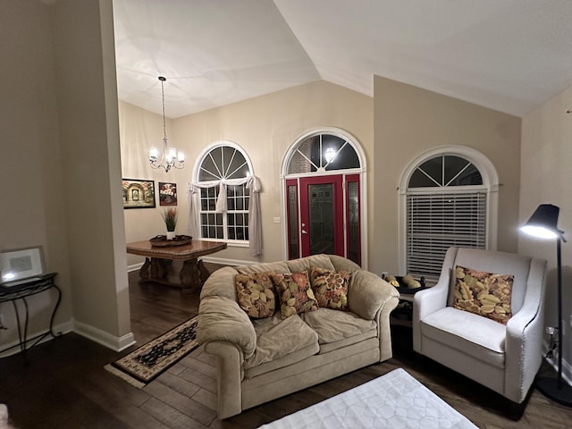 living room with baseboards, a chandelier, wood finished floors, and lofted ceiling