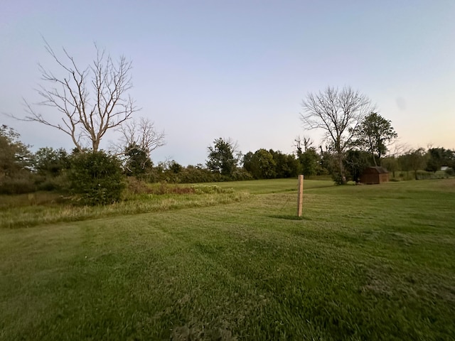 view of yard at dusk