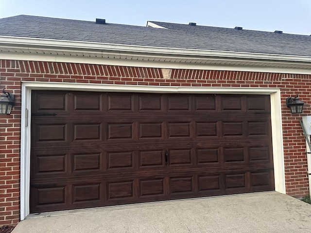 garage with concrete driveway