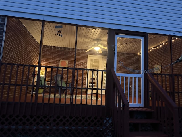 exterior entry at twilight with brick siding