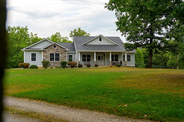 view of front facade with a porch and a front lawn