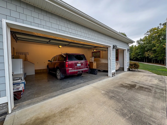 garage with white fridge