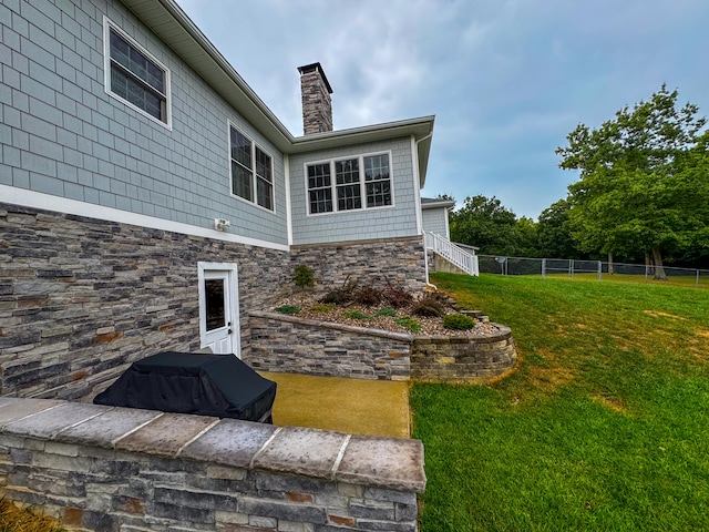 view of home's exterior featuring a yard