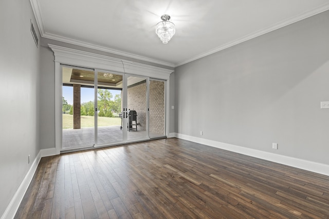 unfurnished room featuring crown molding, french doors, dark hardwood / wood-style flooring, and an inviting chandelier