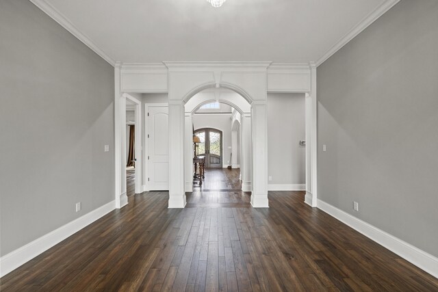 spare room with dark hardwood / wood-style floors and ornamental molding