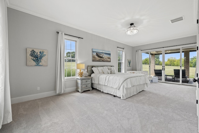 carpeted bedroom featuring ornamental molding and access to outside