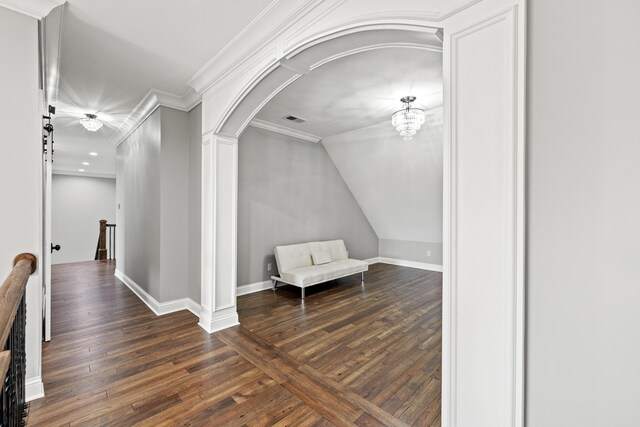 sitting room featuring ornamental molding and dark hardwood / wood-style flooring