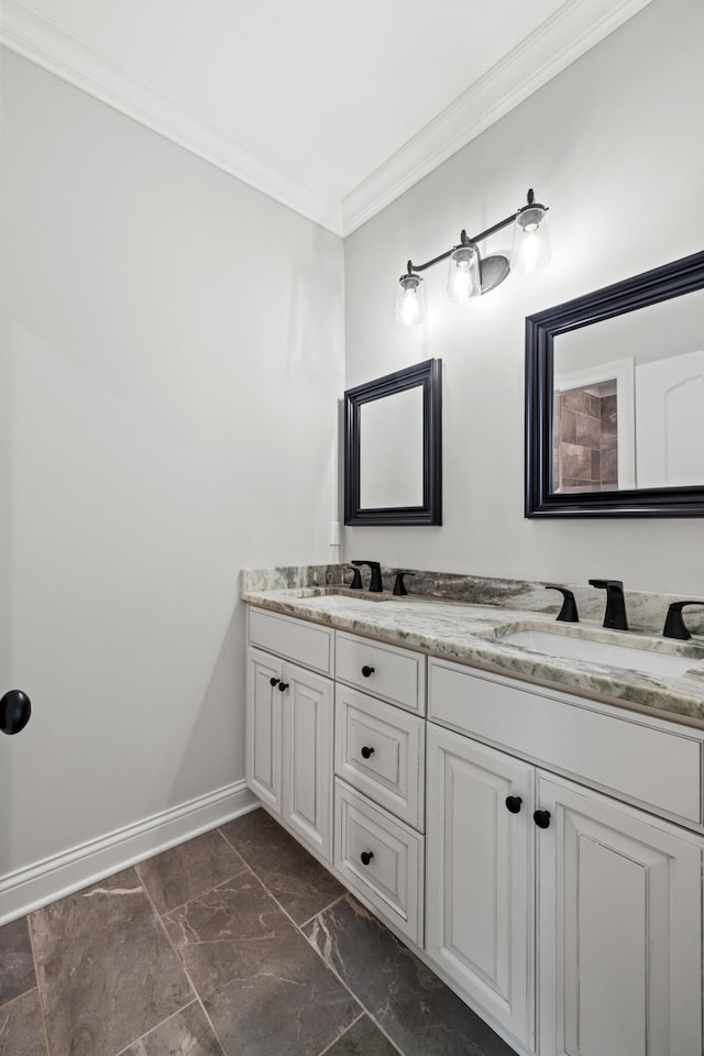 bathroom with ornamental molding and vanity