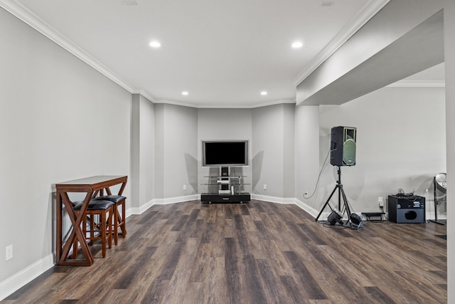 workout room with dark hardwood / wood-style floors and ornamental molding