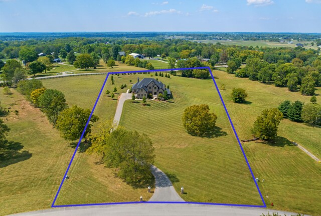 birds eye view of property featuring a rural view