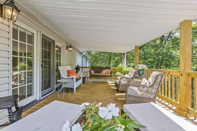 wooden terrace featuring outdoor lounge area