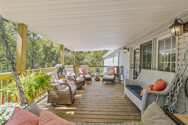 view of patio with an outdoor hangout area and a wooden deck