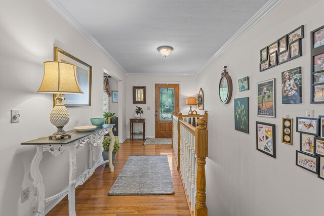 interior space featuring light wood-type flooring and crown molding