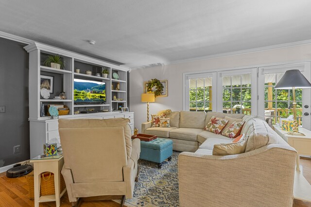 living room featuring ornamental molding and hardwood / wood-style flooring