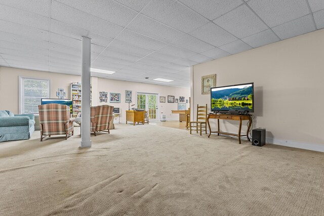 interior space with a paneled ceiling