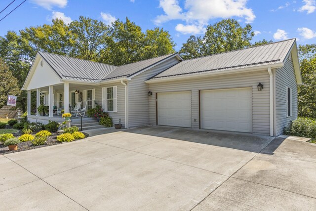 view of front of home with a garage and covered porch