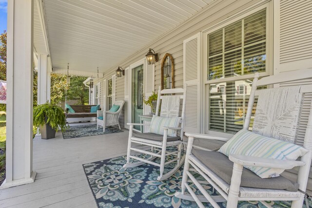 wooden deck featuring covered porch