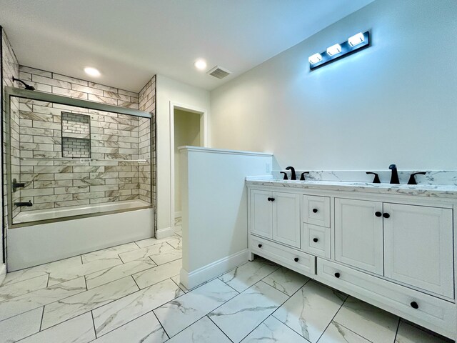 bathroom featuring shower / bath combination with glass door and vanity