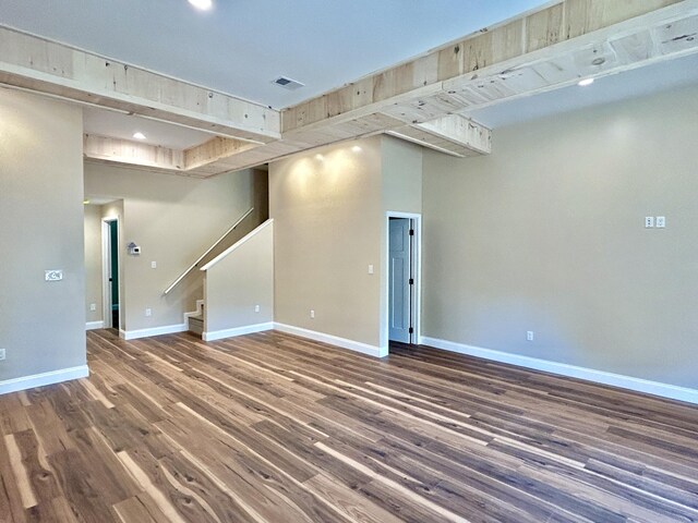 unfurnished room with wood-type flooring