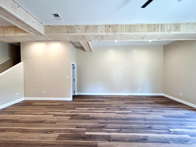 spare room featuring wood-type flooring