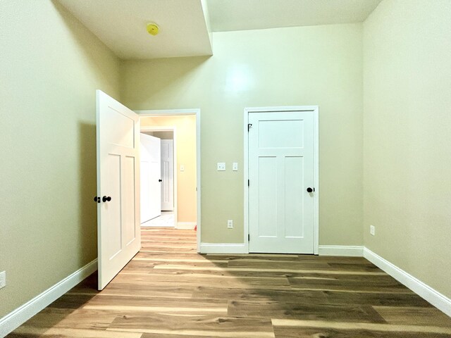 unfurnished room with light hardwood / wood-style floors