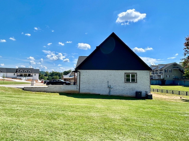 view of home's exterior with a lawn